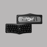 Agar Micro keyboard with a black case and bunny weight